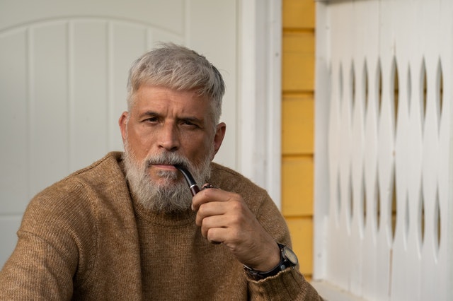 Man using a new smoking pipe